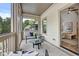 Relaxing screened-in porch with seating, a ceiling fan, and a view of the lush backyard at 2171 James Aly, Atlanta, GA 30345