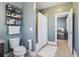 Cozy bathroom with storage shelves, granite vanity, tile flooring, and bathtub with shower curtain at 4224 Dogwood Bend Park, Duluth, GA 30096