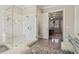 Bathroom with a large glass enclosed shower, a view into the bedroom, and gray tile flooring at 4224 Dogwood Bend Park, Duluth, GA 30096