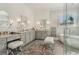Bright bathroom featuring double vanities, modern fixtures, a standalone tub, and a glass enclosed shower at 4224 Dogwood Bend Park, Duluth, GA 30096