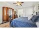 Primary bedroom featuring a four-poster bed, unique armoire, and an ensuite bathroom at 4224 Dogwood Bend Park, Duluth, GA 30096