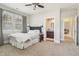 Bright bedroom with neutral decor, plush bed, and en-suite bathroom, creating a peaceful retreat at 4224 Dogwood Bend Park, Duluth, GA 30096