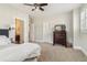 Spacious bedroom featuring plush carpeting, ceiling fan, and an ensuite bathroom, offering comfort and convenience at 4224 Dogwood Bend Park, Duluth, GA 30096