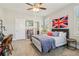 Bedroom with a desk, shelving, a ceiling fan, and a view of the bathroom at 4224 Dogwood Bend Park, Duluth, GA 30096
