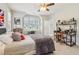 Comfortable bedroom featuring a bed with an accent pillow and a work desk with natural light at 4224 Dogwood Bend Park, Duluth, GA 30096