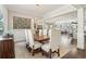 Elegant dining room with hardwood floors and views into the open floor plan kitchen at 4224 Dogwood Bend Park, Duluth, GA 30096