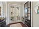 Bright entryway with dark wood floors, stylish doors, and elegant decor at 4224 Dogwood Bend Park, Duluth, GA 30096