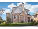 Two-story house with stone and brick exterior, manicured landscaping, and a shingled roof at 4224 Dogwood Bend Park, Duluth, GA 30096