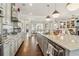 Open kitchen with island, stainless appliances, and views into living room at 4224 Dogwood Bend Park, Duluth, GA 30096