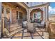 Inviting outdoor patio features decorative stone flooring, wrought iron railings, and comfortable wicker seating at 4224 Dogwood Bend Park, Duluth, GA 30096