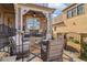 Inviting patio with stone floor, wicker seating, black railings, and brick pillars at 4224 Dogwood Bend Park, Duluth, GA 30096