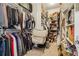 Organized walk-in closet featuring ample hanging space, shelves, and a laundry basket at 4224 Dogwood Bend Park, Duluth, GA 30096