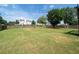 Large grassy backyard surrounded by a wood privacy fence at 900 Cherringham Ct, Alpharetta, GA 30005