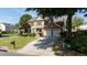 Charming two-story home with brick accents, red shutters, manicured lawn, and a paved double car driveway at 900 Cherringham Ct, Alpharetta, GA 30005