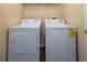 Laundry room features a white washer and dryer set at 900 Cherringham Ct, Alpharetta, GA 30005