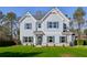 Charming two-story home with gray siding, blue shutters and manicured lawn at 3725 Heron Creek Ct, Loganville, GA 30052
