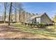 Green backyard with lush landscaping and stone patio at 500 Huntgate Rd, Woodstock, GA 30189