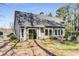 Spacious backyard with lush greenery and sunroom addition at 500 Huntgate Rd, Woodstock, GA 30189
