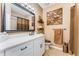 Neutral bathroom featuring a white vanity, framed mirror, and tile floors at 500 Huntgate Rd, Woodstock, GA 30189