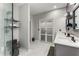 Stylish bathroom with double vanity, glass shower, and modern fixtures at 500 Huntgate Rd, Woodstock, GA 30189