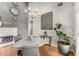 Dining area featuring hardwood floors, elegant chandelier, neutral decor, and ample natural light at 500 Huntgate Rd, Woodstock, GA 30189