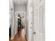 Inviting hallway with hardwood floors leading to an open living space at 500 Huntgate Rd, Woodstock, GA 30189