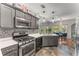 Gourmet kitchen featuring stainless appliances and granite countertops at 500 Huntgate Rd, Woodstock, GA 30189