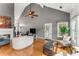 Spacious living room featuring vaulted ceilings, hardwood floors, and access to the backyard, and fireplace at 500 Huntgate Rd, Woodstock, GA 30189