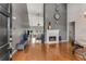 Entryway and living room with soaring ceilings, hardwood floors, fireplace and view to the seating area at 500 Huntgate Rd, Woodstock, GA 30189