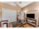The home office has a modern desk, TV, closet, and great natural light at 500 Huntgate Rd, Woodstock, GA 30189