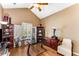 The home office features hardwood floors, vaulted ceilings, and bright windows at 500 Huntgate Rd, Woodstock, GA 30189