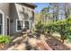 Cozy outdoor patio area with seating, perfect for relaxing and enjoying the peaceful backyard at 500 Huntgate Rd, Woodstock, GA 30189