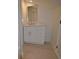 Bathroom featuring single vanity, gray tile floors and modern fixtures at 2078 Lyle Ave, College Park, GA 30337