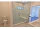 Luxurious bathroom with glass-enclosed shower, marble accents, and modern fixtures at 2078 Lyle Ave, College Park, GA 30337