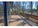 Spacious wooden deck with railings offering a great outdoor space for entertaining and relaxing at 2078 Lyle Ave, College Park, GA 30337