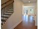 Elegant entryway features hardwood floors, staircase with modern railing, and lots of natural light at 2078 Lyle Ave, College Park, GA 30337