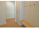 Mudroom with bench seating, storage cabinets, and wall hooks at 2078 Lyle Ave, College Park, GA 30337