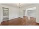 Elegant dining room features hardwood floors, wainscoting, and a modern chandelier at 4001 Oak Field Dr, Loganville, GA 30052