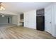 Open kitchen area with gray cabinets, black appliances, and light wood flooring at 4001 Oak Field Dr, Loganville, GA 30052