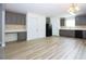 Efficient kitchen with gray cabinets, black appliances, and adjacent dining area at 4001 Oak Field Dr, Loganville, GA 30052