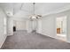 Large living area with a cozy fireplace and access to more rooms at 4001 Oak Field Dr, Loganville, GA 30052