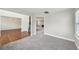 Inviting living room with plush carpet and natural light from the large window at 4001 Oak Field Dr, Loganville, GA 30052