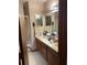 Functional bathroom features a double sink vanity, and a shower with a glass door at 1040 Rolling Green Dr, Acworth, GA 30102