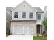Charming two-story home with brick and siding, featuring a two-car garage and well-manicured lawn at 1071 Crest Mill Dr, Marietta, GA 30008