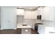 Modern kitchen featuring white cabinets, stainless steel appliances, and a center island with quartz countertop at 1071 Crest Mill Dr, Marietta, GA 30008