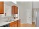 Functional kitchen featuring stainless steel appliances, wood cabinets, and ample counter space for cooking at 2450 Cordillo Ne Dr, Dacula, GA 30019