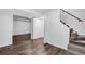 Finished basement with vinyl wood flooring, open entryways, and staircase at 2512 Hidden Hills Dr, Marietta, GA 30066