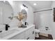 Bright bathroom showcasing double sink vanity with updated fixtures and shower-tub combination at 2512 Hidden Hills Dr, Marietta, GA 30066