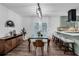 Open dining area with stylish furniture, light fixture, and views of the kitchen and backyard at 2512 Hidden Hills Dr, Marietta, GA 30066