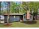 Charming home with stone accents, newly landscaped front yard, and inviting wooden front porch at 2512 Hidden Hills Dr, Marietta, GA 30066